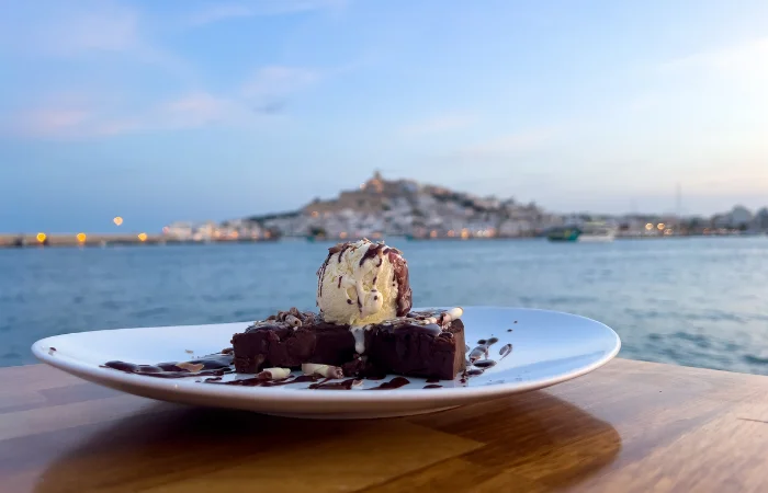 Eating dessert ibiza on the background